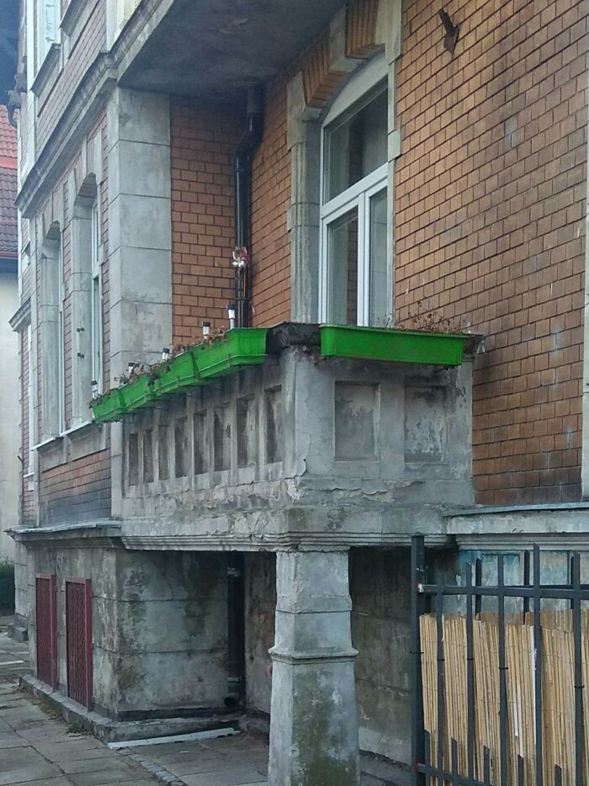 balcony with green flower pots