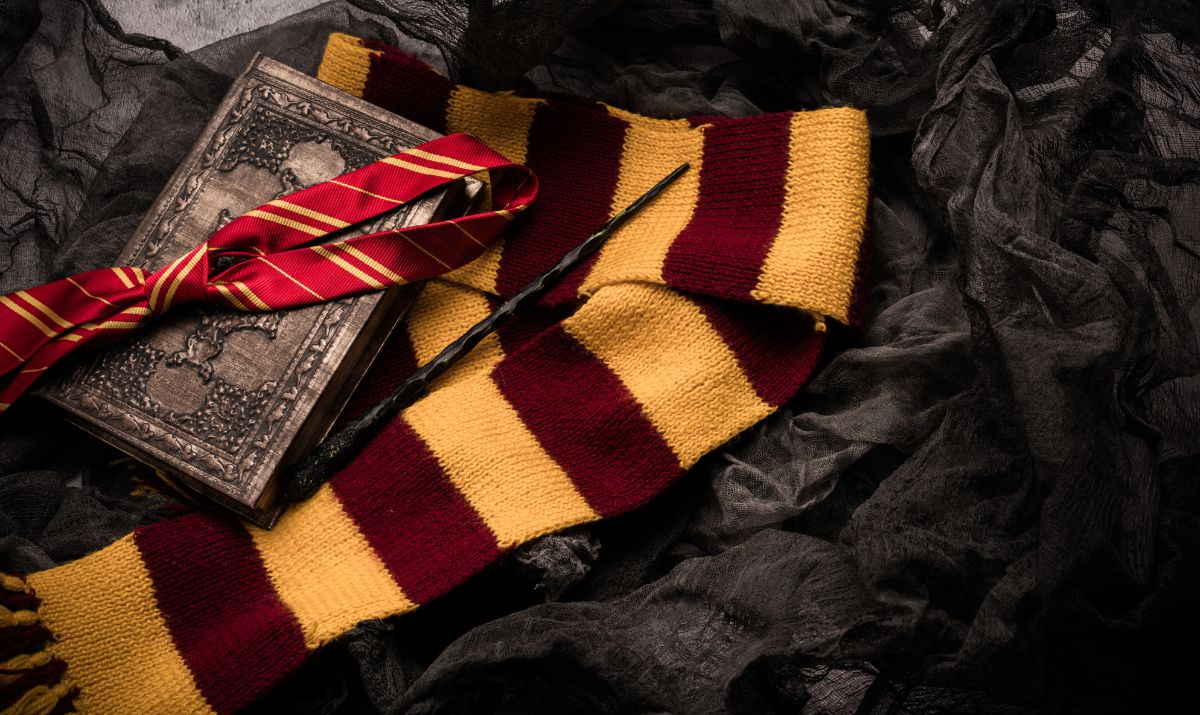 Magic stick, Harry Potter scarf, book on black background